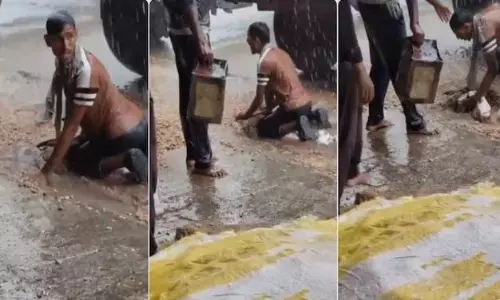 Farmer desperately tries to save crop from rain, Union minister calls