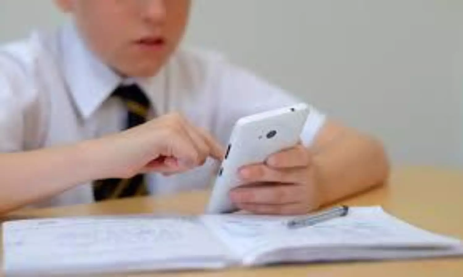 kid using phone