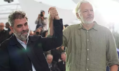 Cannes: Julian Assange seen wearing Stop Israel t-shirt, promotes documentary