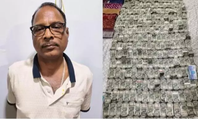 Odisha official throws bundles of money out of window ahead of raid