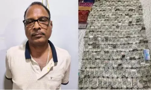 Odisha official throws bundles of money out of window ahead of raid