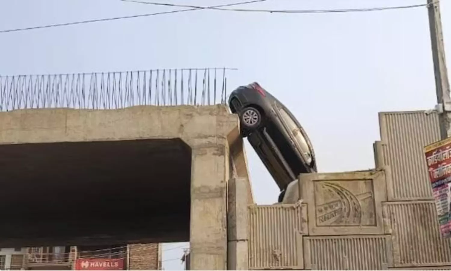 Car dangles over edge of flyover in UP, occupants escape unhurt