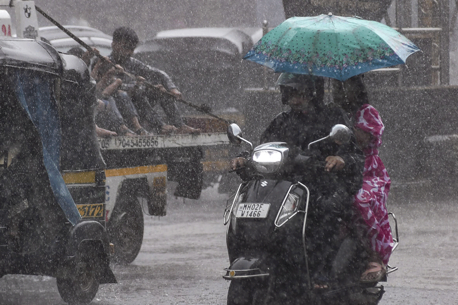 Mumbai landslide kills two as heavy rain paralyzes city