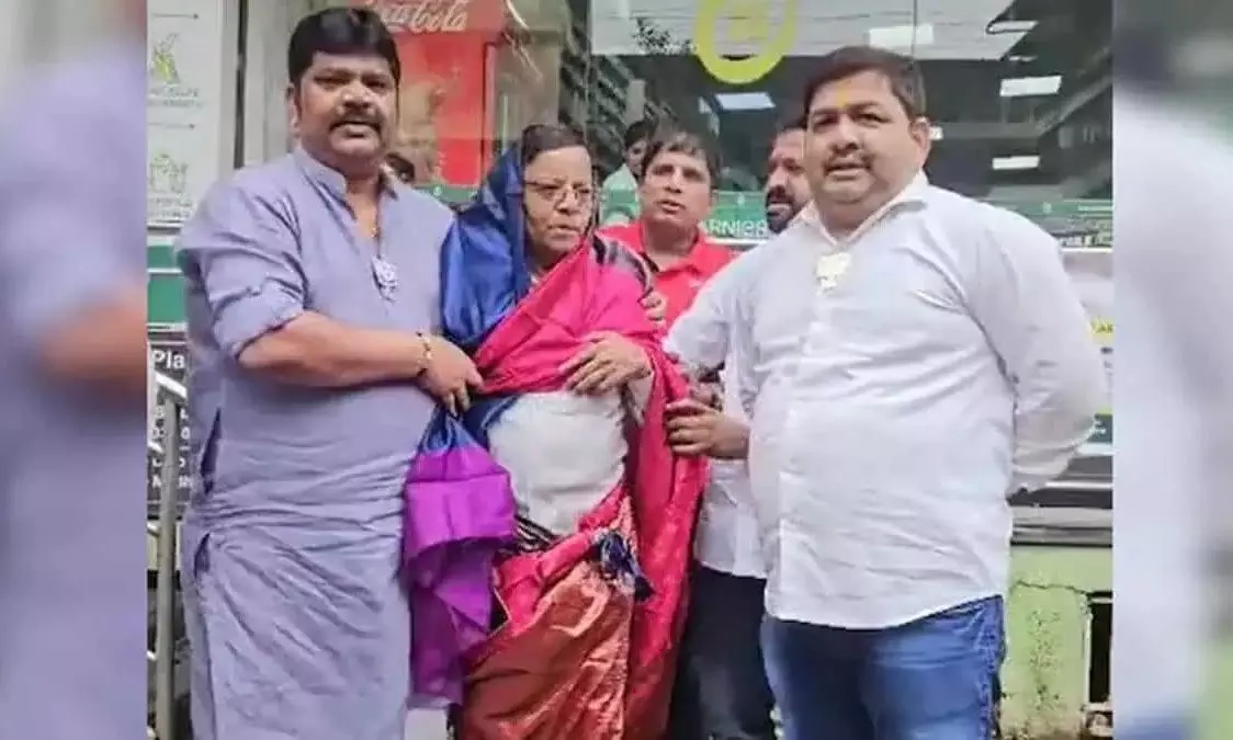 BJP workers allegedly force Congress leader to wear saree over morphed Modi post BJP workers allegedly force Congress leader to wear saree over morphed Modi post