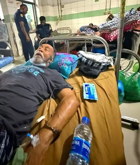 Outcry in Bangladesh after photos show ex-minister handcuffed to hospital bed before death