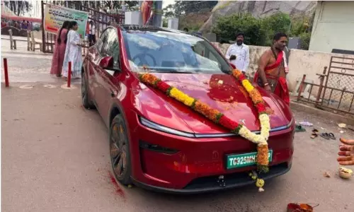No safety without pooja: Hyderabad man performs pooja for his new Tesla’s safety