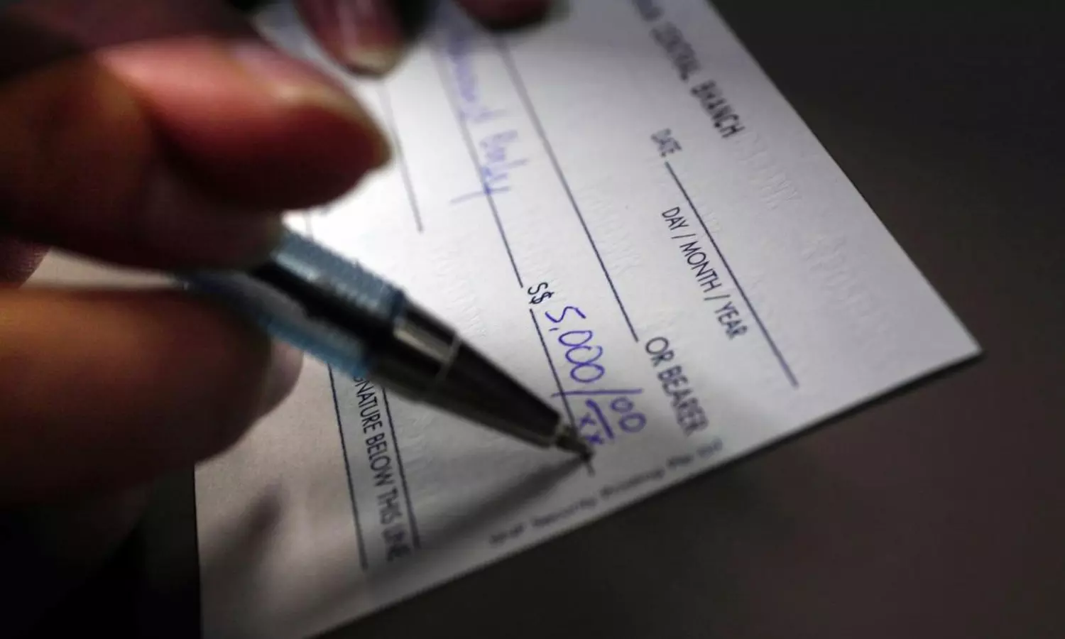 Govt school teacher suspended after cheque with spelling errors goes viral