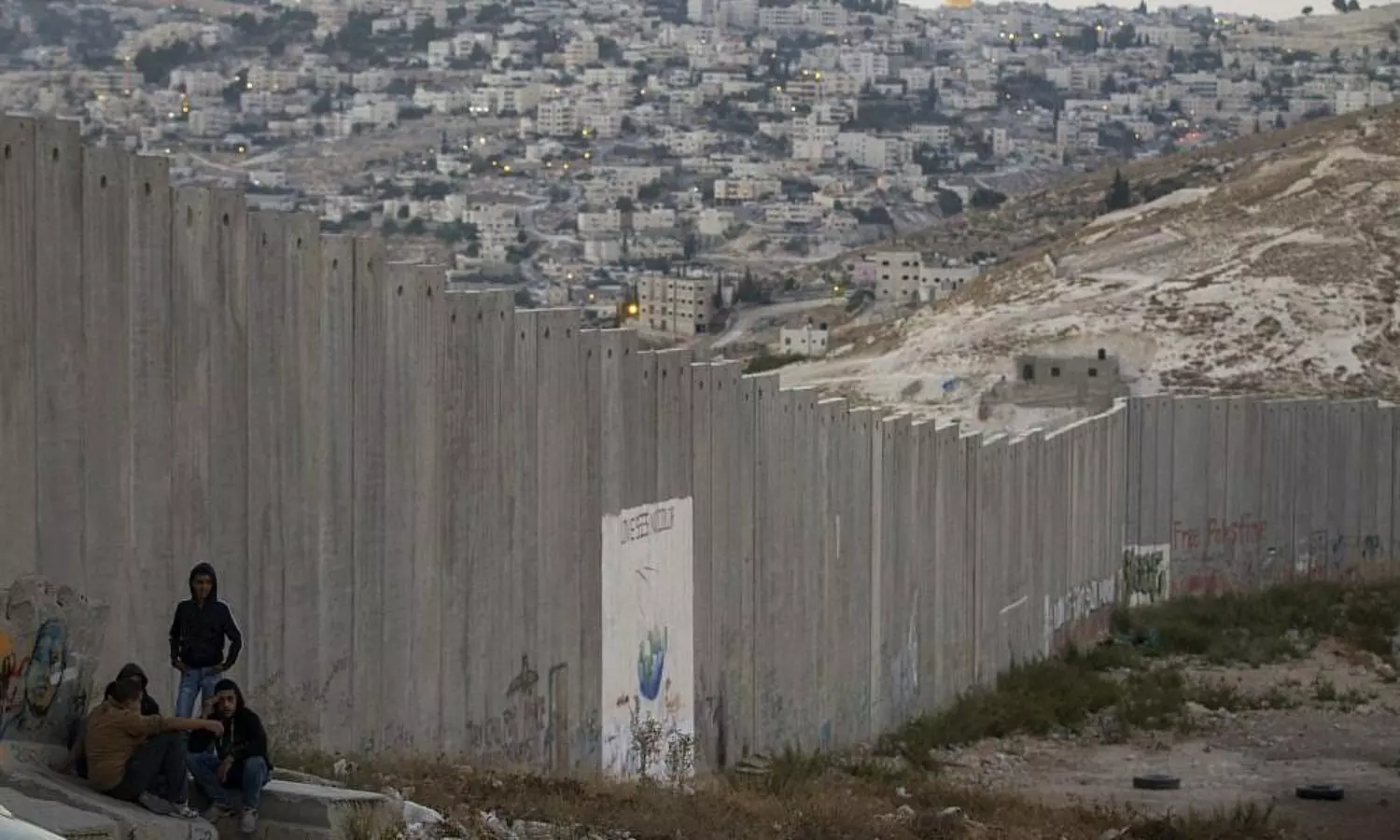 With Israel erecting 1,000 more barriers, Palestinians feel jailed in their city in the West Bank