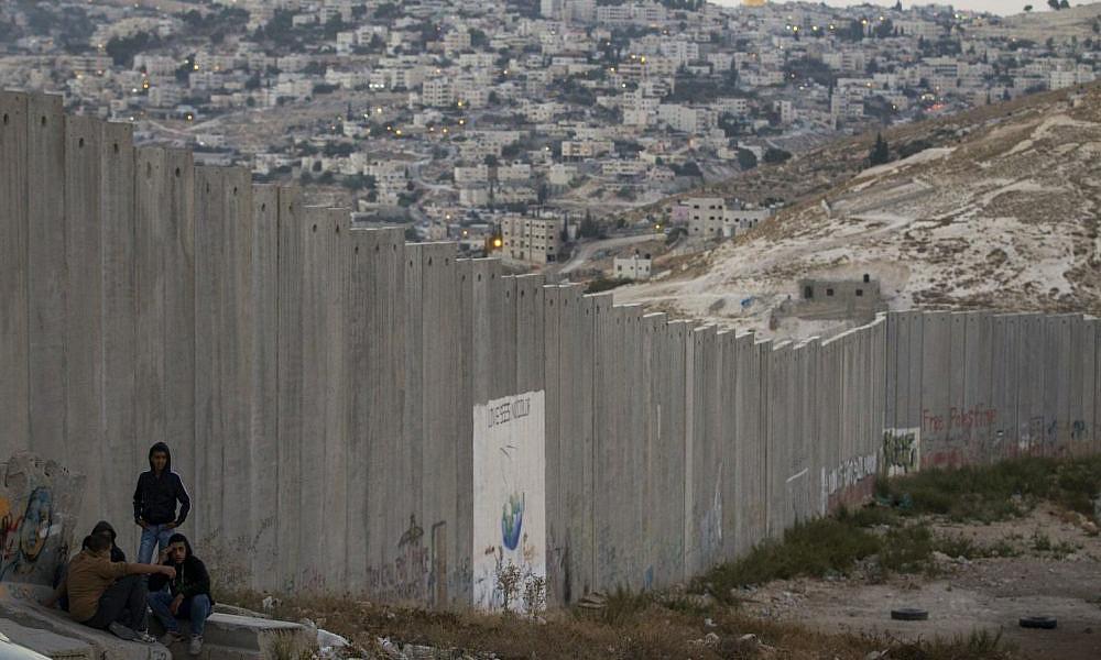 With Israel erecting 1,000 more barriers, Palestinians feel jailed in their city in the West Bank