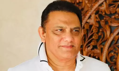 Former cricketer Azharuddin sworn in as Telangana minister Former cricketer Azharuddin sworn in as Telangana minister