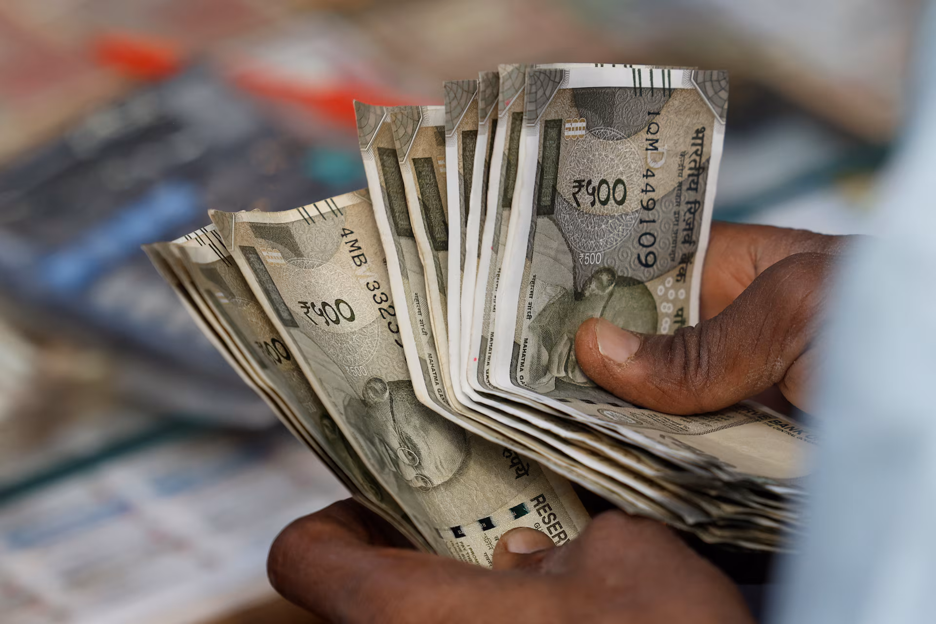 Indian rupee falls to record low of 90.64 against US dollar