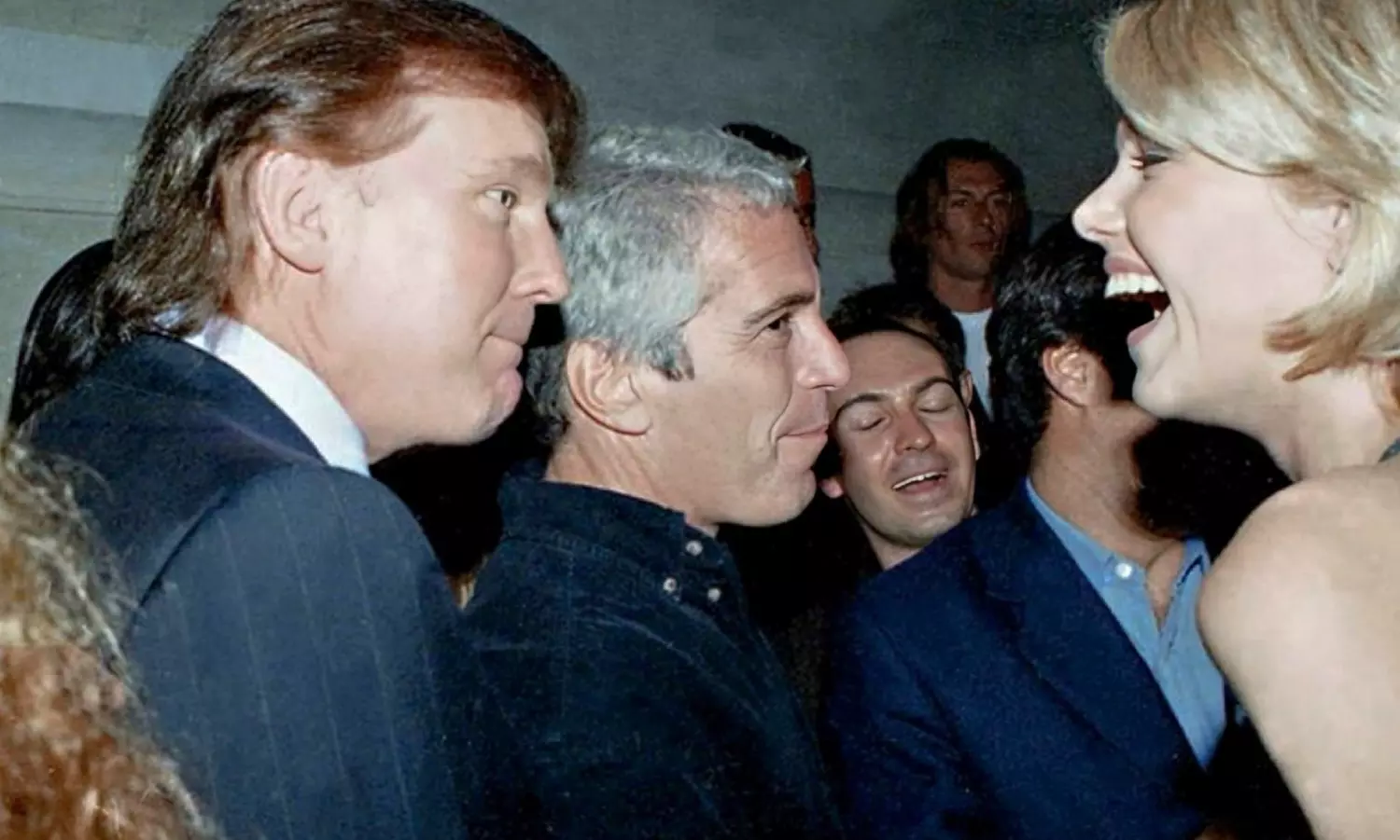 Epstein files reveal photos with global figures as critics allege redactions aim to shield Trump
