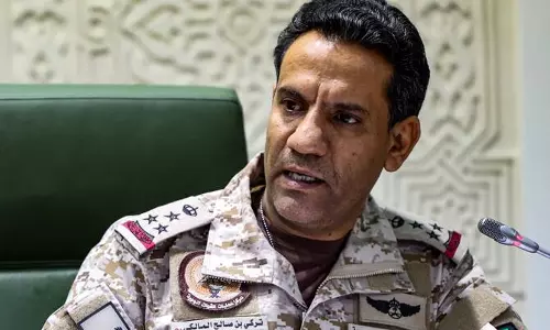 Saudi Defence Ministry spokesman Major General Turki Al-Maliki speaking during a press briefing in military uniform.