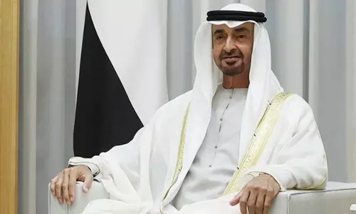 UAE President Sheikh Mohamed bin Zayed Al Nahyan seated indoors during an official engagement.