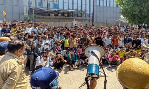 Workers protest for wage hike turns violent in UP: vehicles torched Workers protest for wage hike turns violent in UP: vehicles torched
