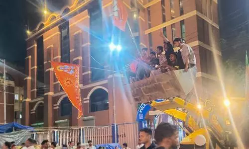 BJP workers use bulldozer to demolish meat shops in Kolkata after poll win