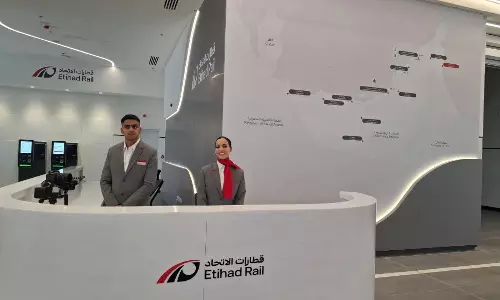 Staff members stand at the reception area inside Etihad Rail’s Fujairah Passenger Station, with a route map of the UAE rail network displayed on the wall behind them. Staff members stand at the reception area inside Etihad Rail’s Fujairah Passenger Station, with a route map of the UAE rail network displayed on the wall behind them.