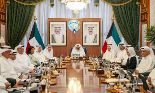 Prime Minister Sheikh Ahmad Al-Abdullah Al-Ahmad Al-Sabah chairs a Kuwait Cabinet meeting with ministers seated around a conference table. Prime Minister Sheikh Ahmad Al-Abdullah Al-Ahmad Al-Sabah chairs a Kuwait Cabinet meeting with ministers seated around a conference table.