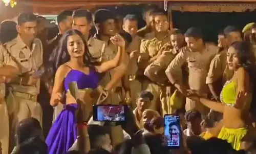 Police conduct questioned after being seen recording vulgar dance as men cheer at Varanasi temple