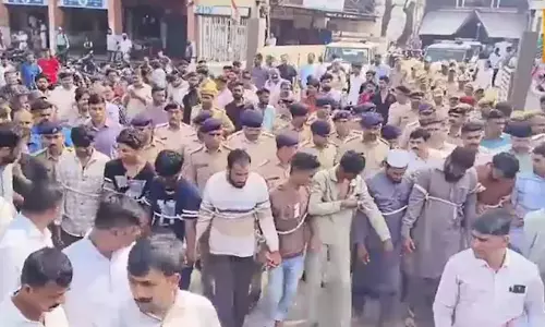 Gujarat Police parade Muslim youths on streets tied with ropes; row